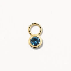 Blue Topaz Circle Charm In 10k Gold
