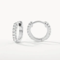 White Topaz Rainbow Huggie Earrings In Silver