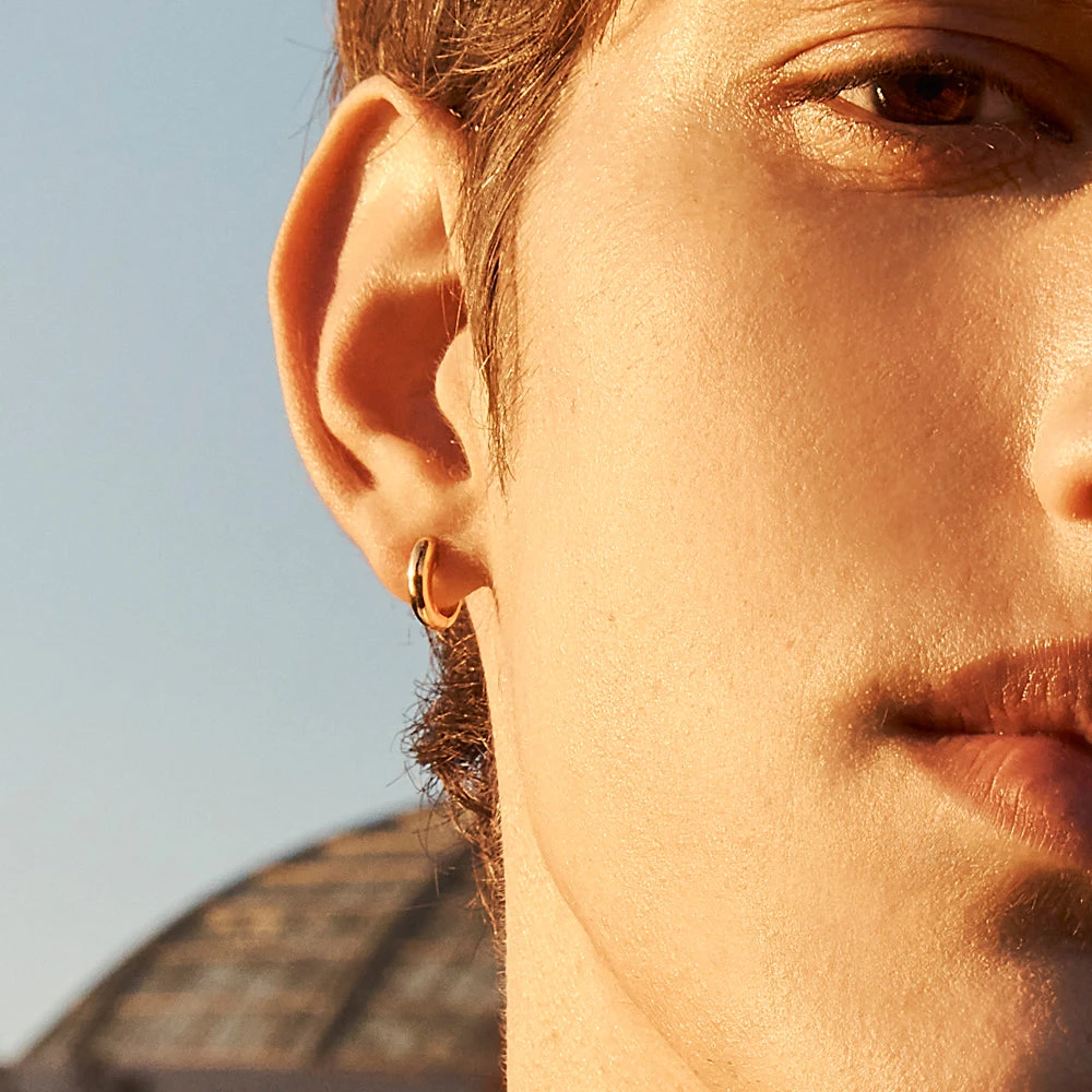 Midi Huggie Earrings In Gold 2 Midi Huggie Earrings In Gold - Image 2