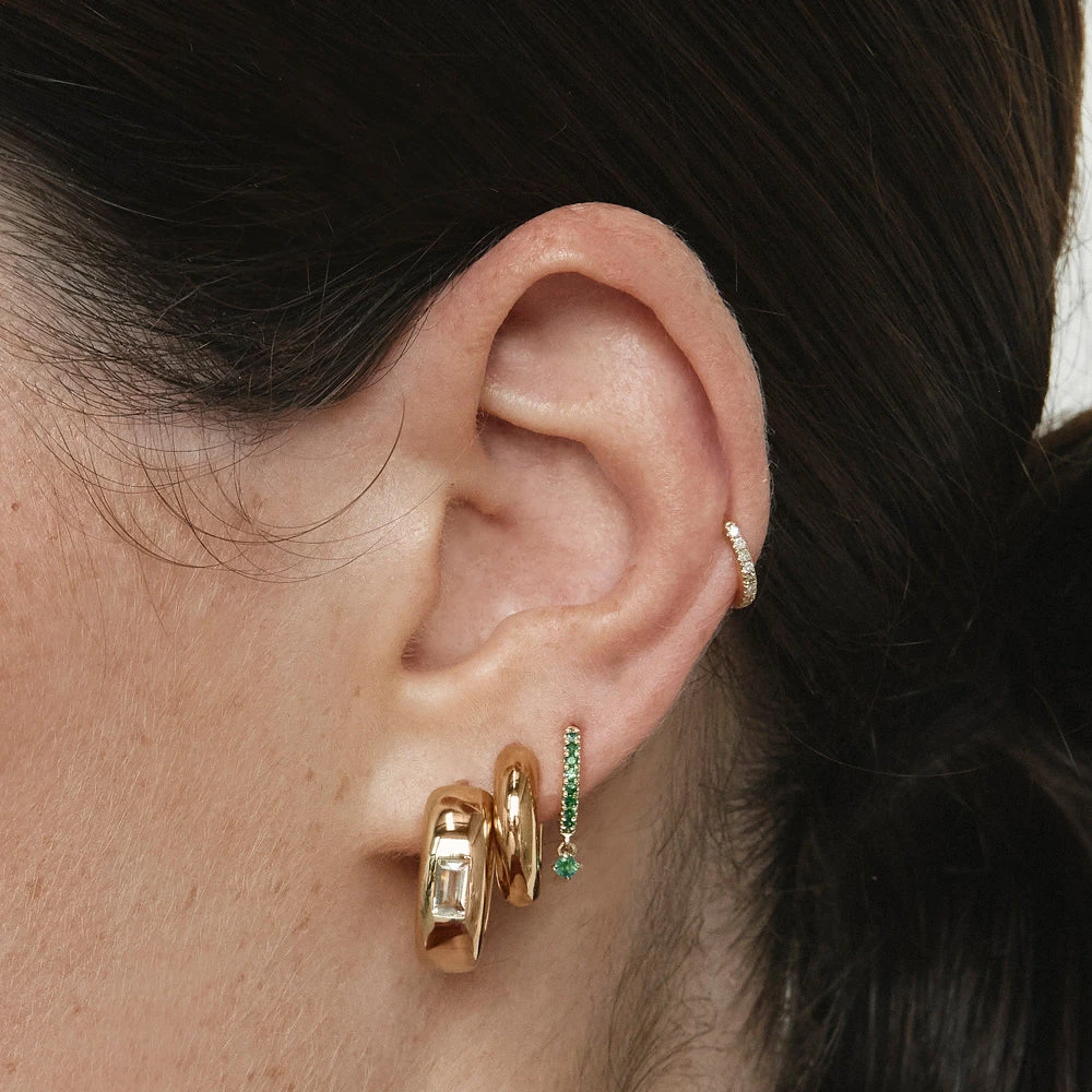 White Topaz Baguette Curve Huggies In Gold 2 White Topaz Baguette Curve Huggies In Gold - Image 2