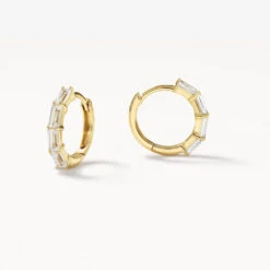 White Topaz Baguette Huggie Earrings In Gold