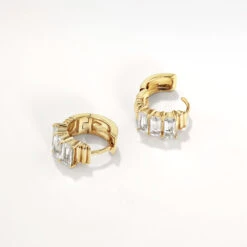 White Topaz Baguette Textured Huggie Earrings In Gold -Fashion Accessories Store white topaz baguette textured huggie earrings in gold medley jewellery earrings 41227242930406