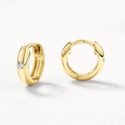 White Topaz Round Curve Huggies In Gold